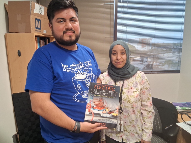 Dr. Reem Salim (right), a full-time faculty member in HCC’s engineering department, and her colleague, Hector Villasana (left), a lab assistant at HCC, have written an experimental lab manual titled “Electric Circuits” that includes 31 practical lab exercises for engineering students.