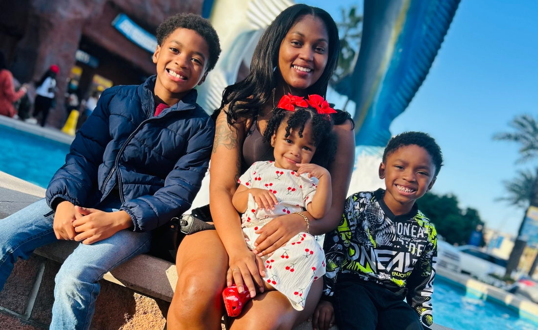 HCC student Jeromecia Brantley poses for a photo with her three children.